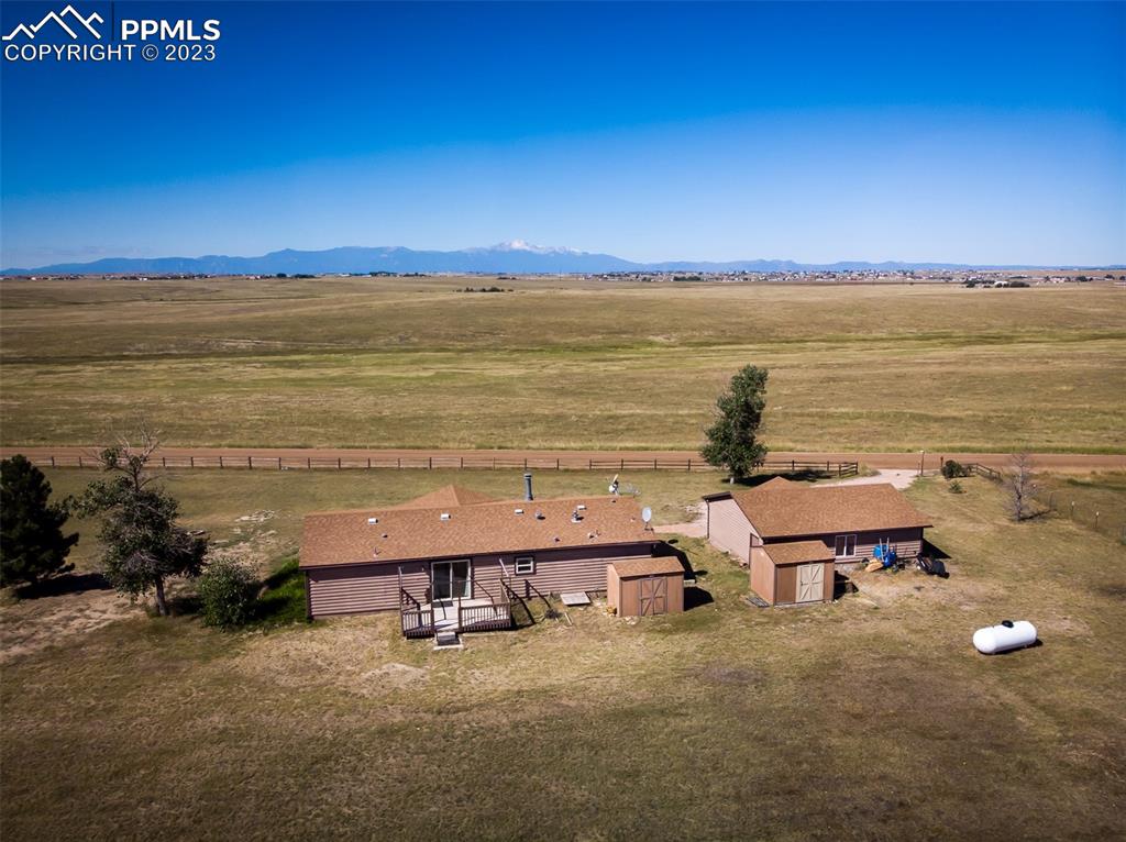 5695 Peerless Farms Road Peyton, CO 80831 - Photo 5 of 50 a balcony with an ocean view