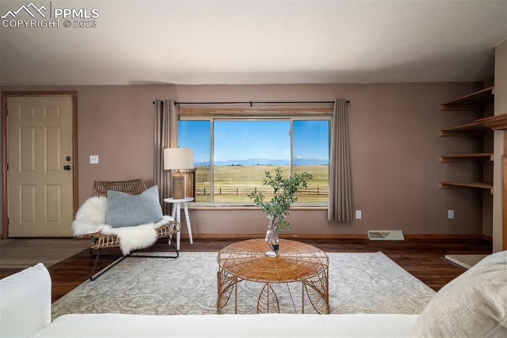 5695 Peerless Farms Road Peyton, CO 80831 - Photo 10 of 50 a living room with furniture and a window