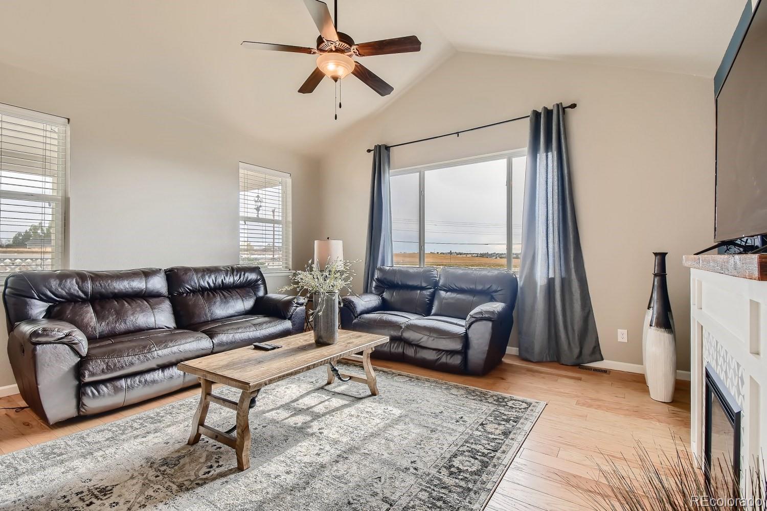 16035 Newark Lane Brighton, CO 80602 - Photo 13 of 40 a living room with furniture and a window