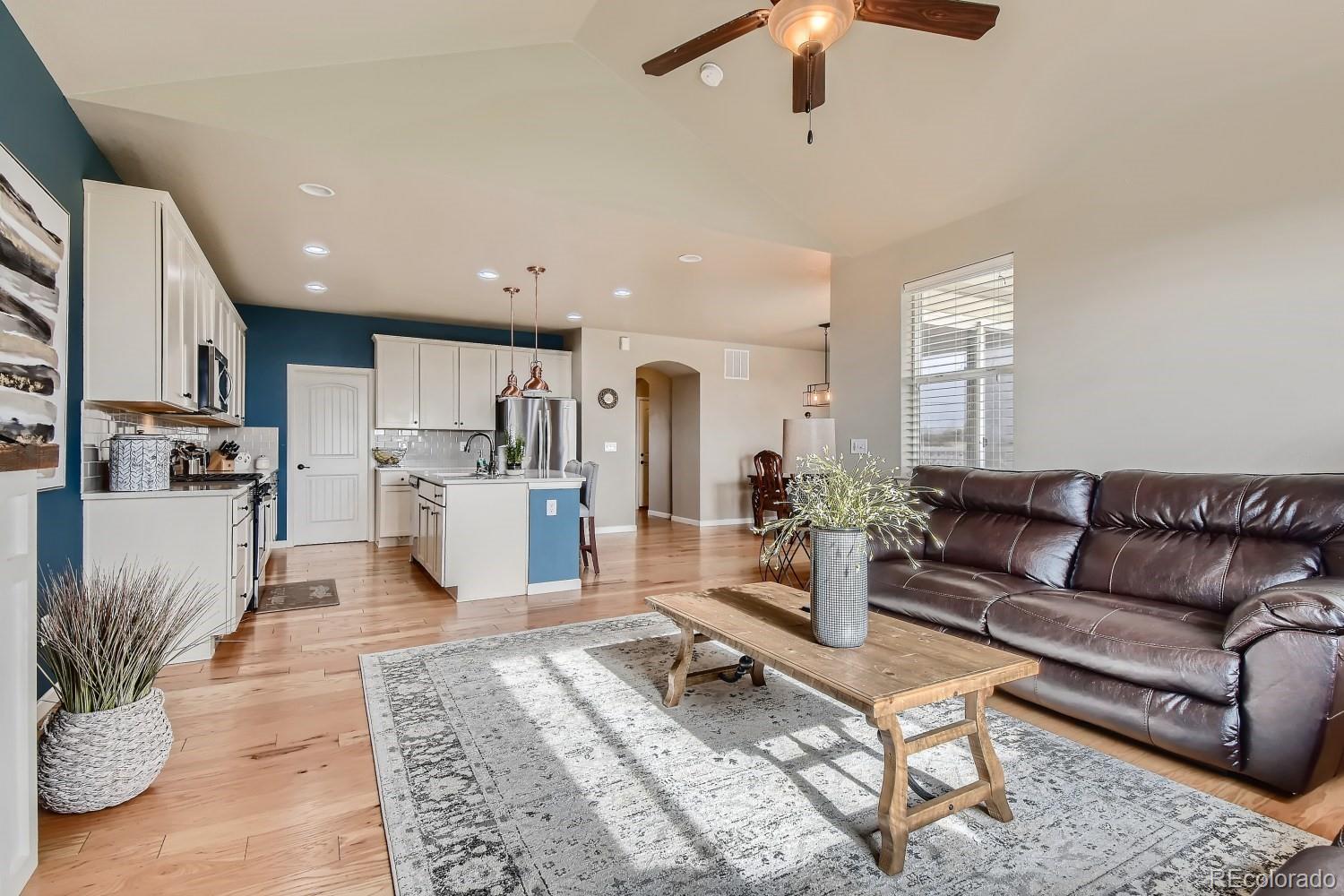 16035 Newark Lane Brighton, CO 80602 - Photo 14 of 40 a living room with furniture and kitchen view