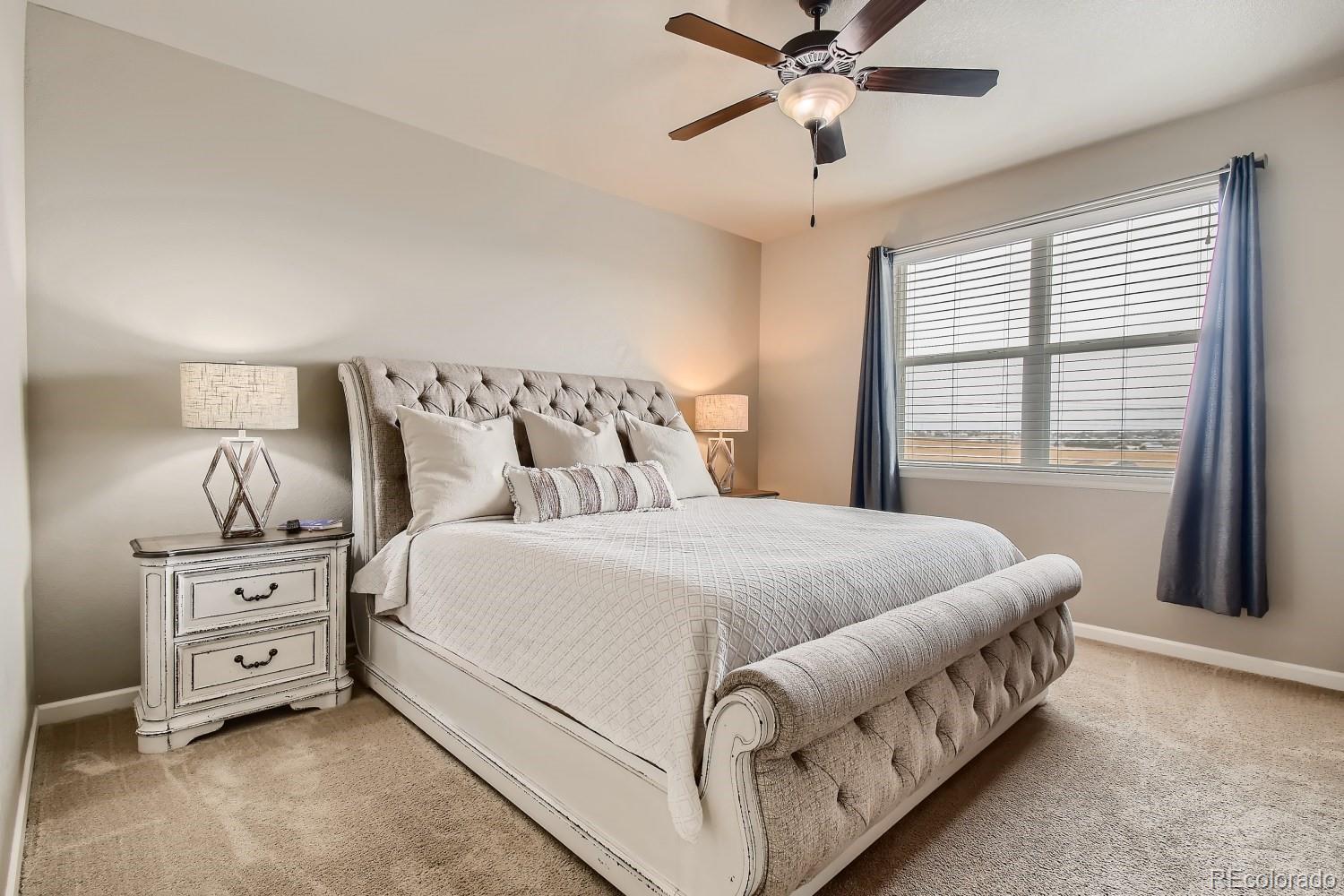 16035 Newark Lane Brighton, CO 80602 - Photo 18 of 40 a bed room with a bed and a window