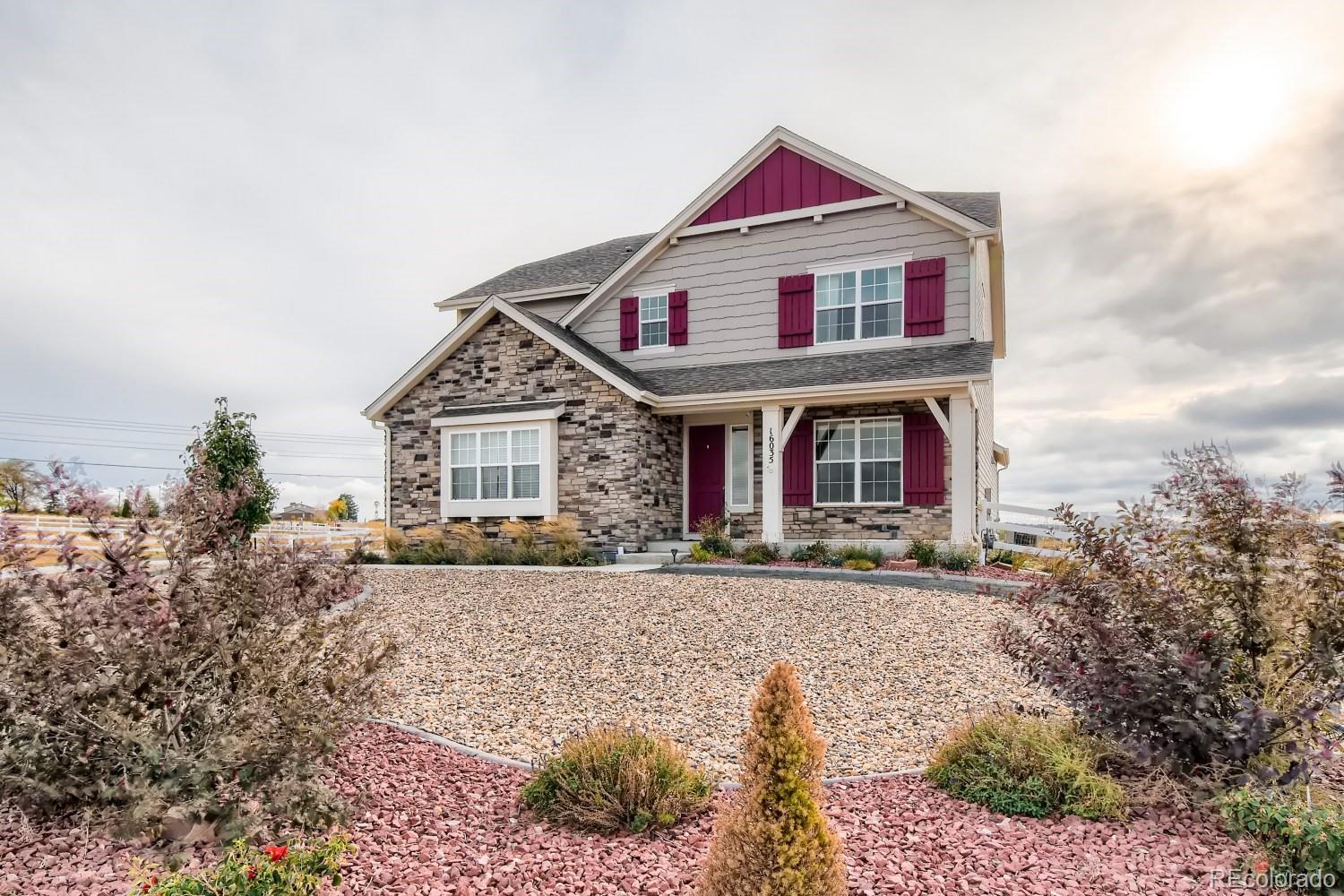 16035 Newark Lane Brighton, CO 80602 - Photo 4 of 40 a front view of a house with garden
