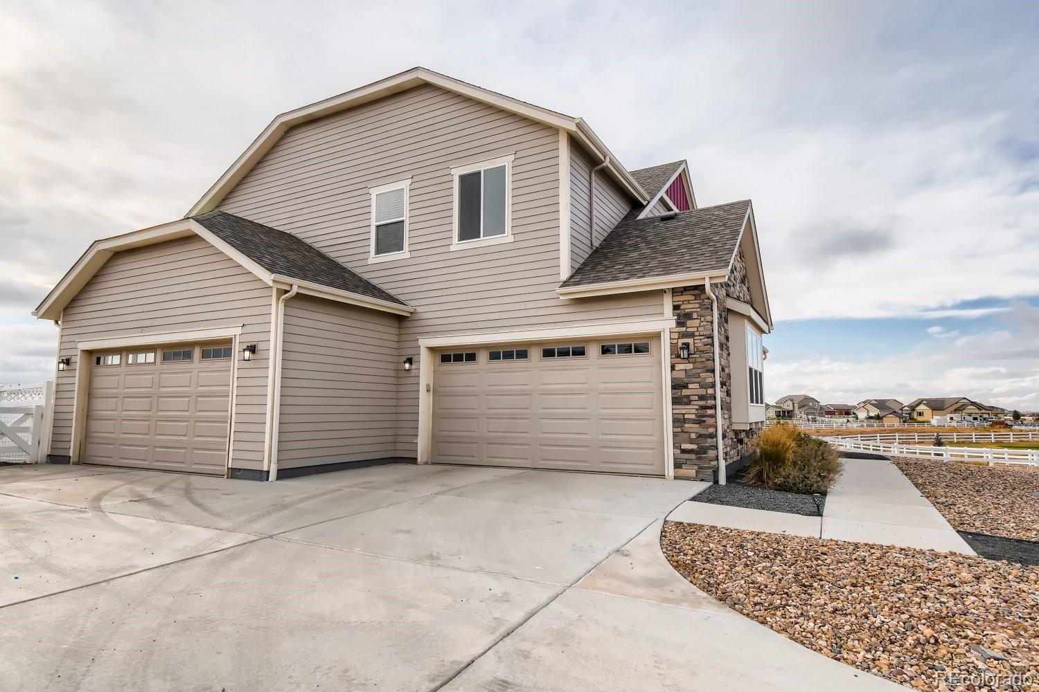 16035 Newark Lane Brighton, CO 80602 - Photo 5 of 40 a view of a house with a garage