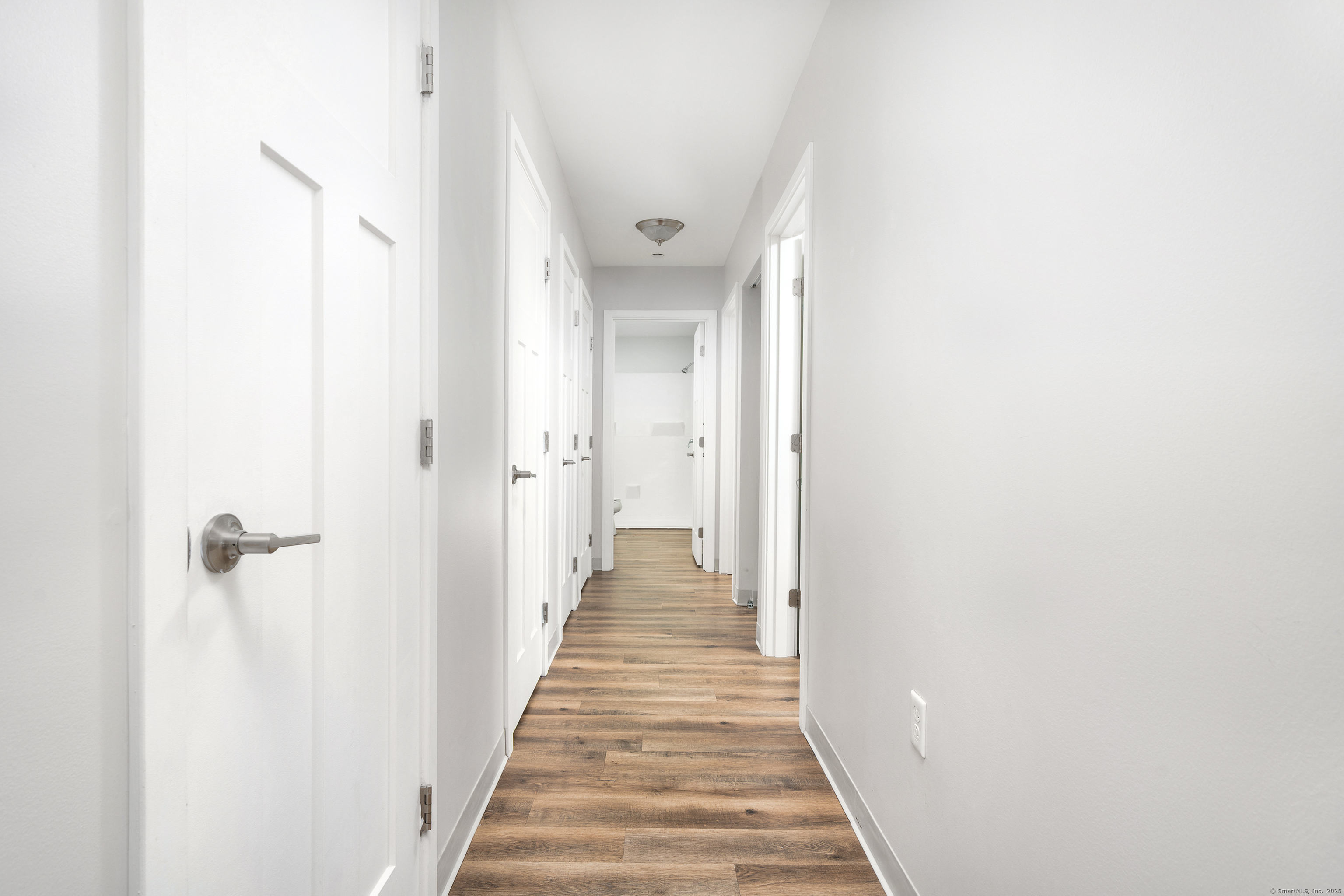 170 Ridge Road, Unit 104 Wethersfield, CT 06109 - Photo 13 of 23 a view of a hallway with wooden floor