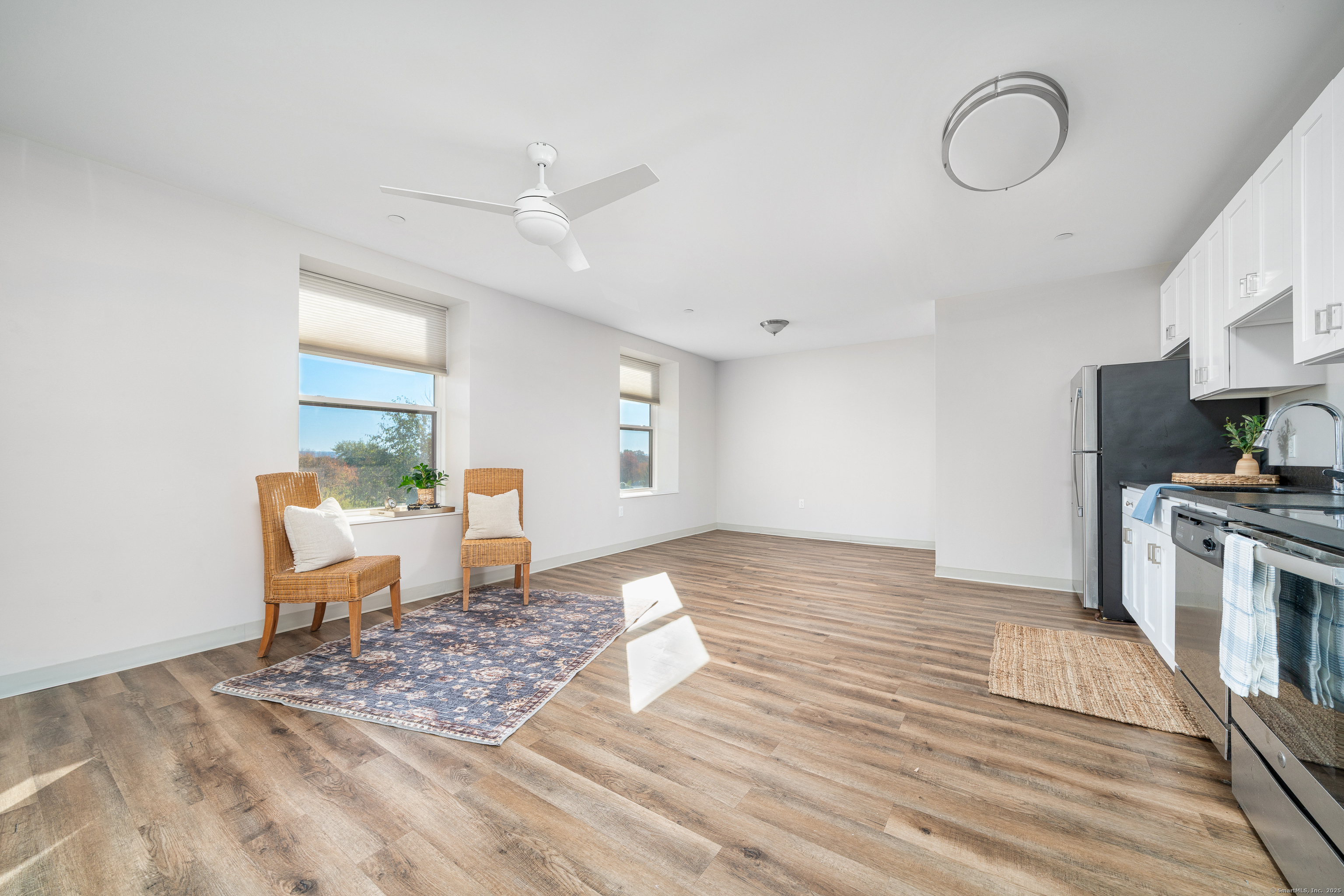 170 Ridge Road, Unit 104 Wethersfield, CT 06109 - Photo 8 of 23 a living room with furniture and a fireplace
