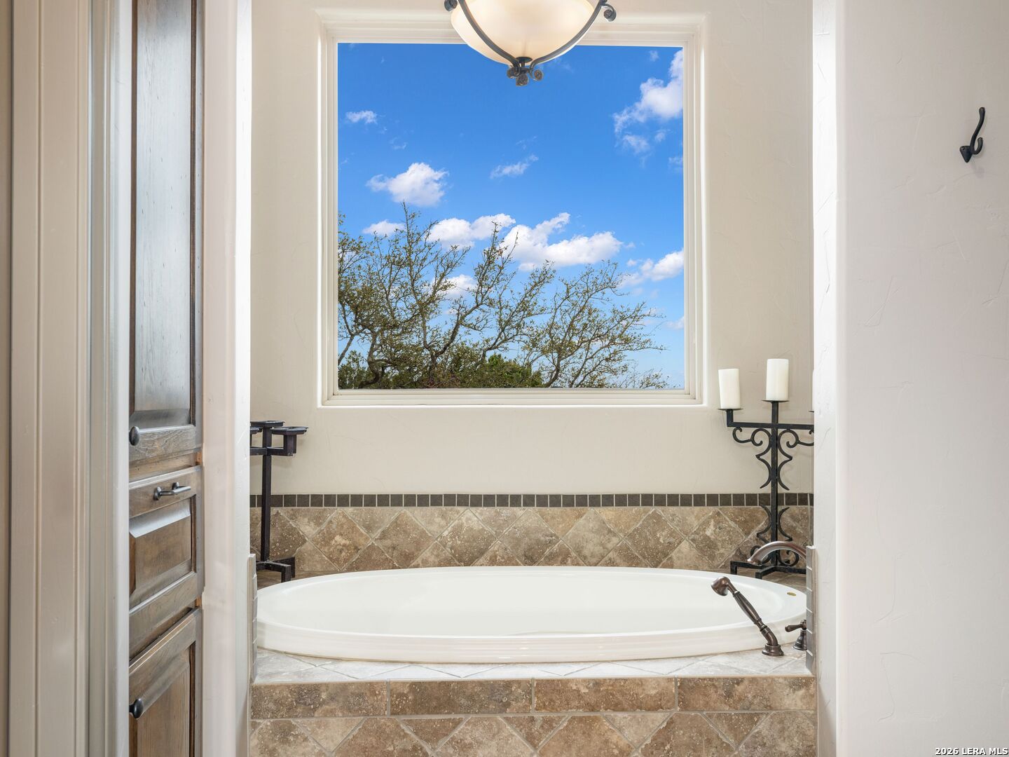 2717 B & R Road Utopia, TX 78884 - Photo 26 of 70 a bathroom with a tub and shower