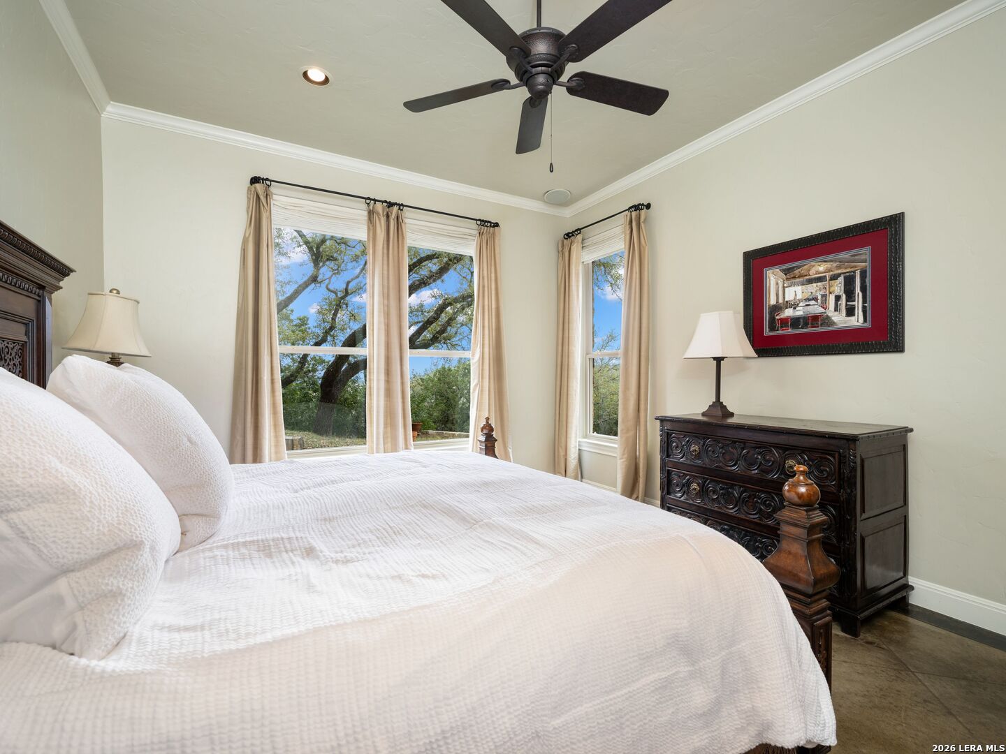 2717 B & R Road Utopia, TX 78884 - Photo 32 of 70 a bedroom with a bed and a painting on the wall