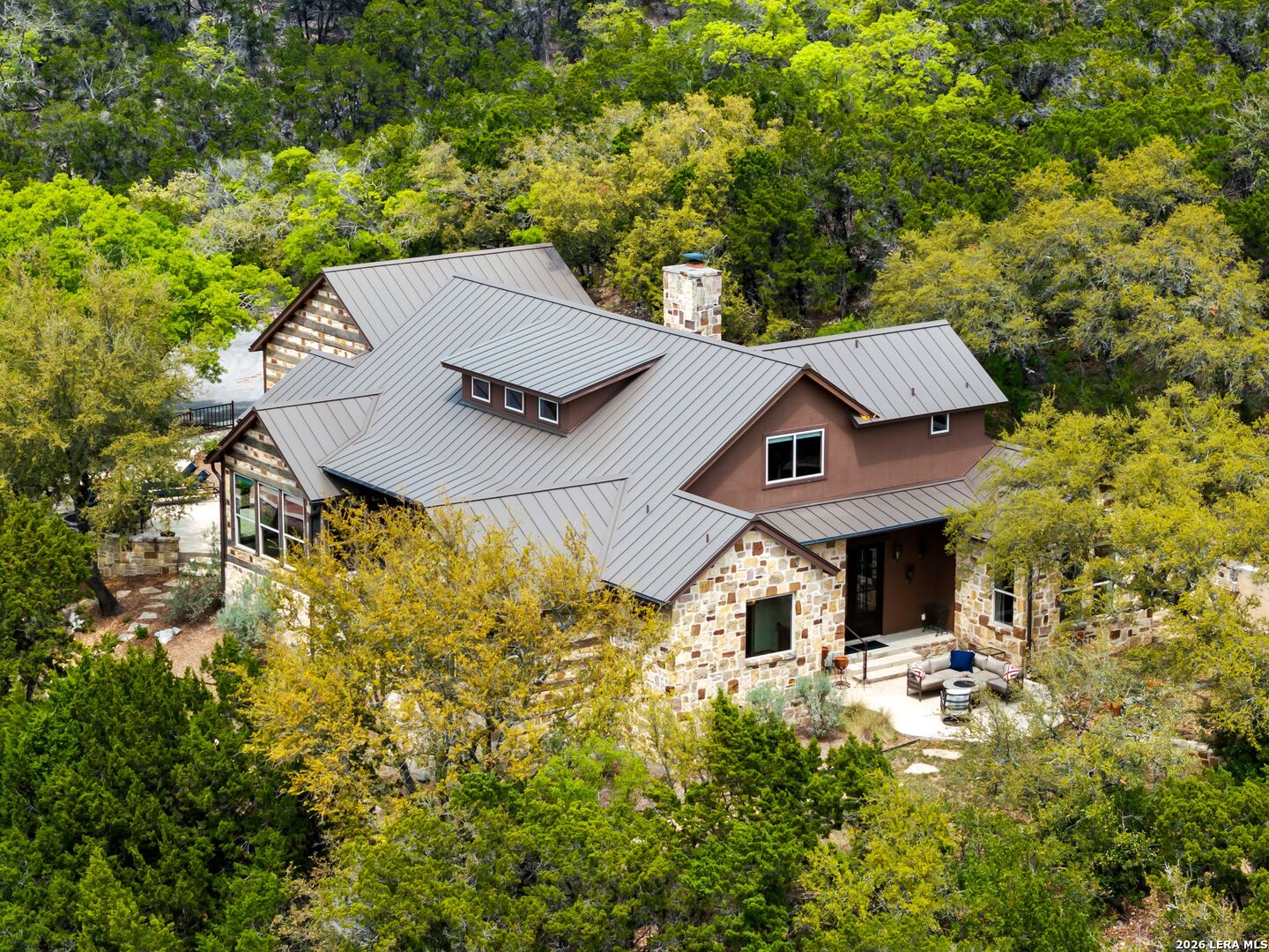 2717 B & R Road Utopia, TX 78884 - Photo 4 of 70 an aerial view of a house with yard and trees all around