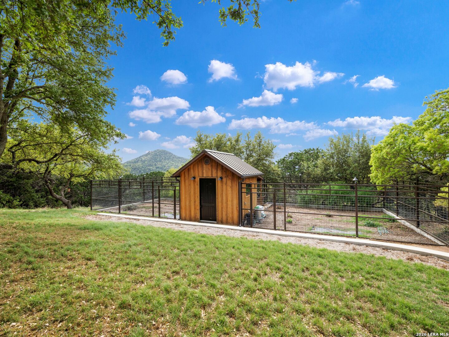 2717 B & R Road Utopia, TX 78884 - Photo 50 of 70 a view of a house with a backyard and a tree