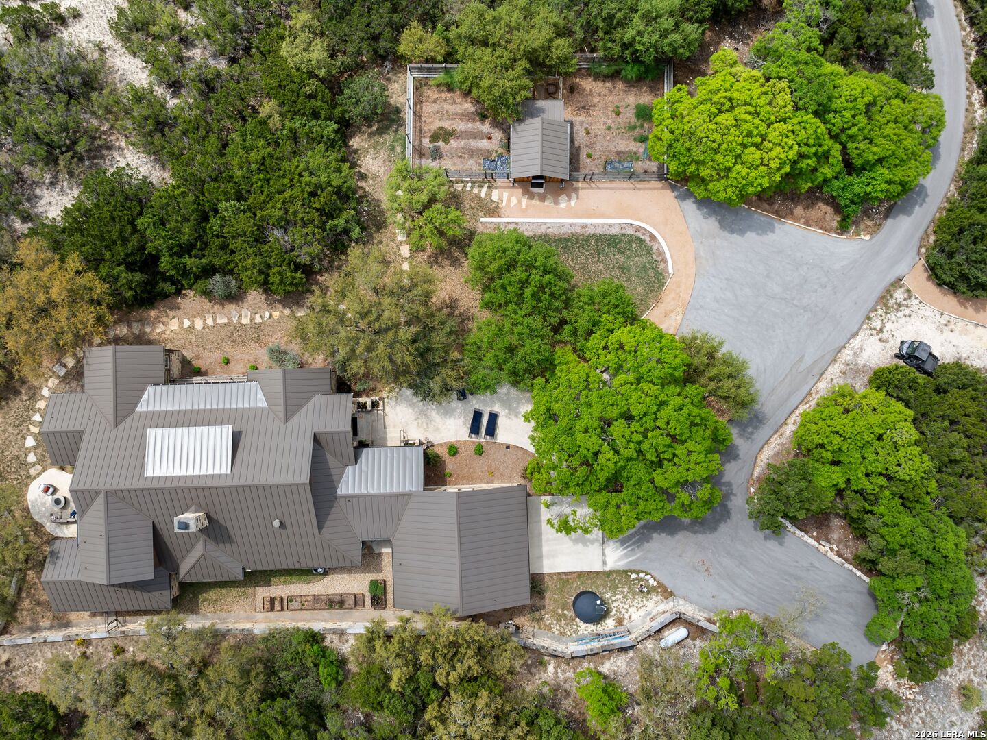 2717 B & R Road Utopia, TX 78884 - Photo 60 of 70 an aerial view of a house with a yard and lake view