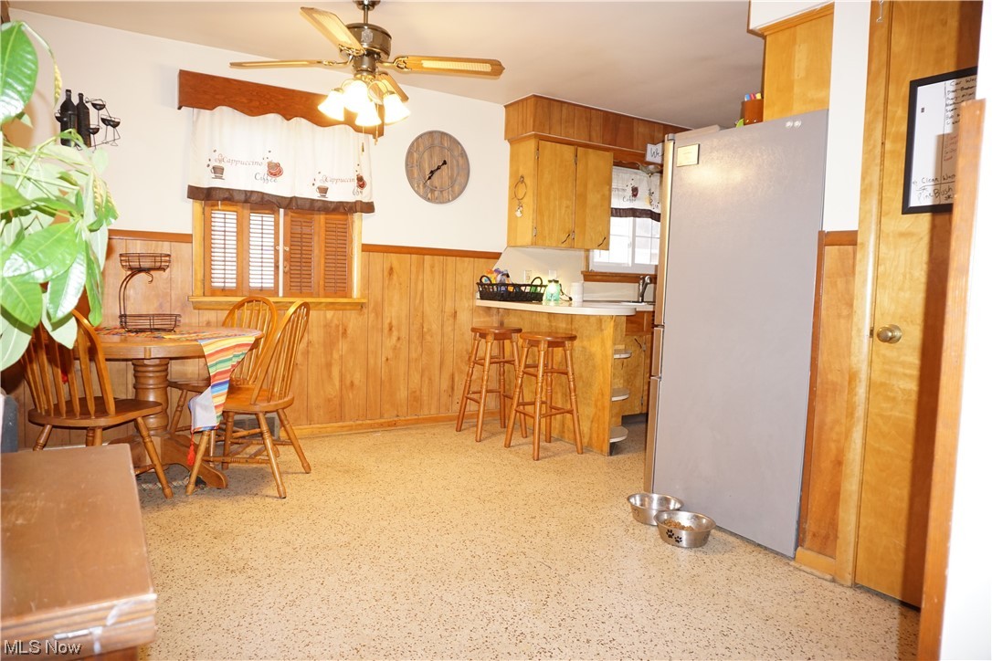 4611 8th Street Northwest Canton, OH 44708 - Photo 5 of 29 Kitchen with ceiling fan, a wealth of natural light, and white fridge