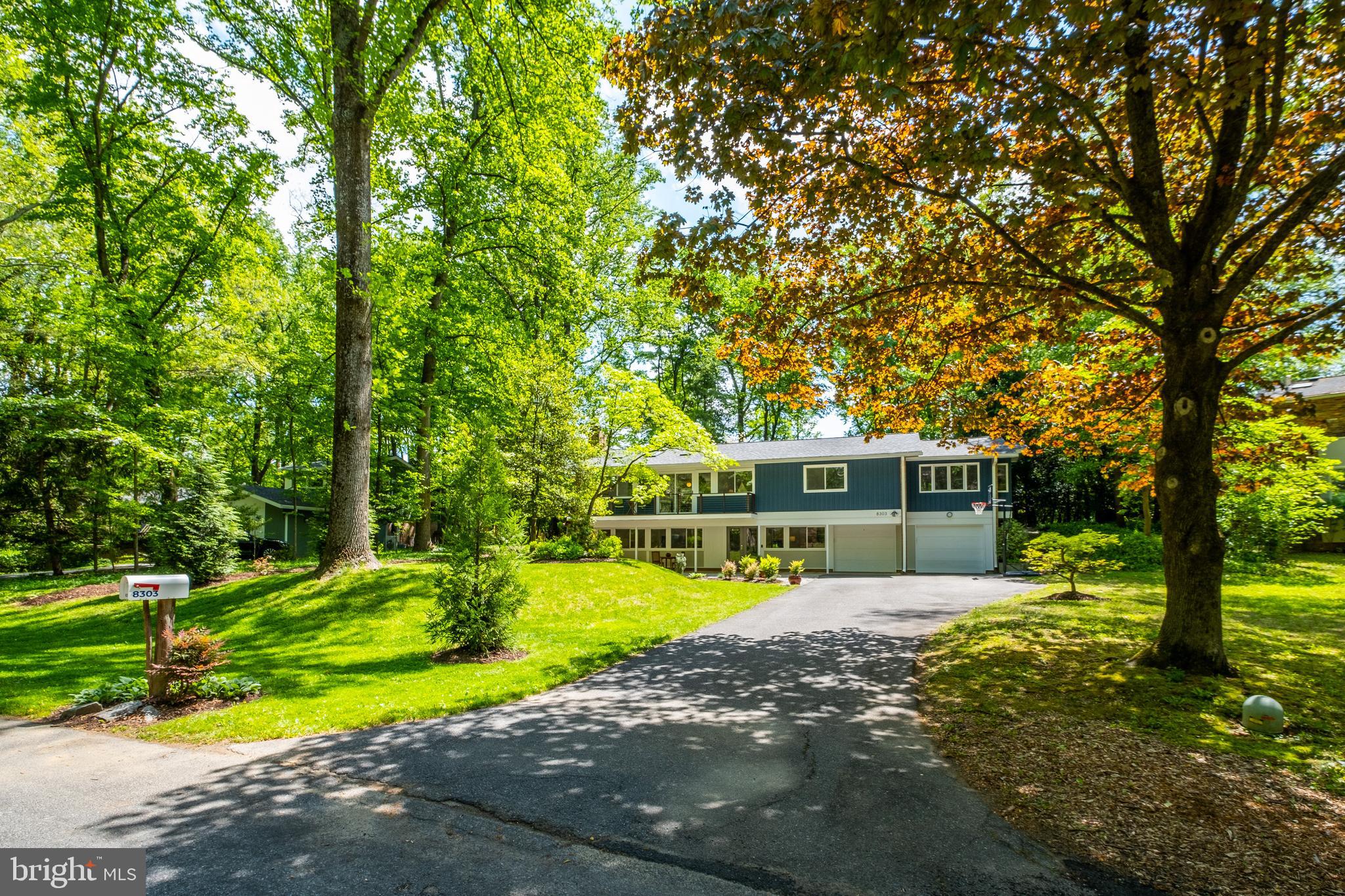 a view of a house with swimming pool and yard