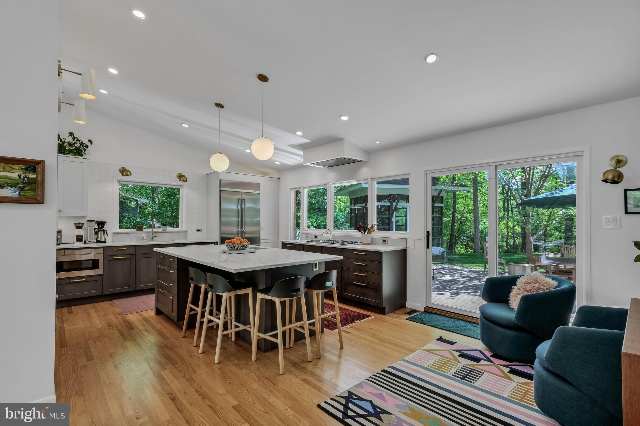 8303 Still Spring Court Bethesda, MD 20817 - Photo 16 of 56 a kitchen with a table and chairs in it