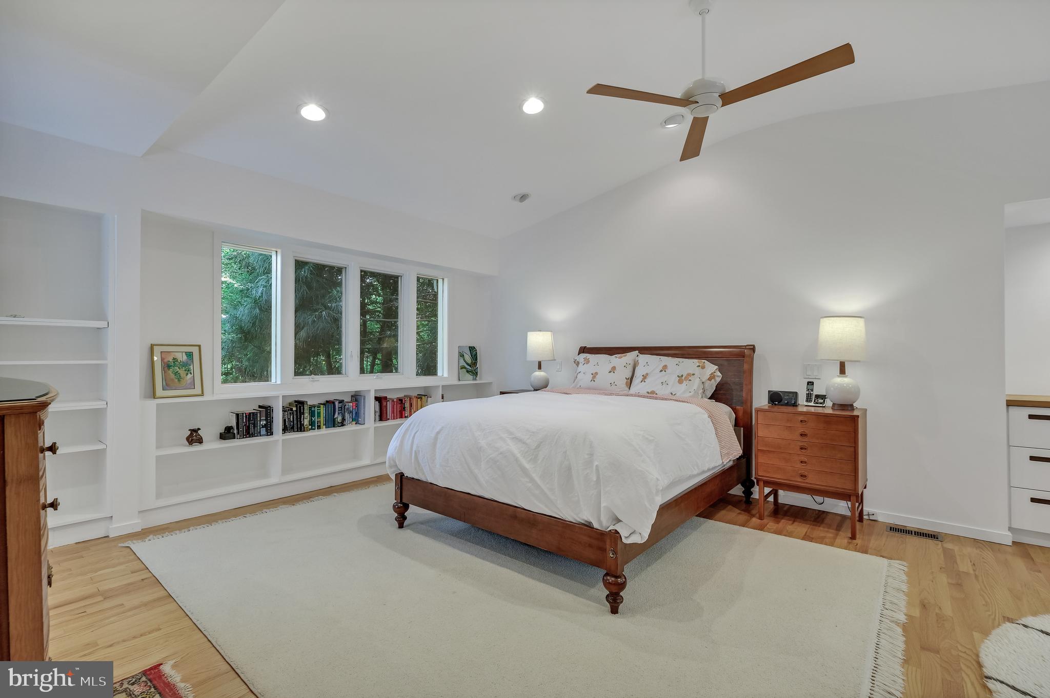 8303 Still Spring Court Bethesda, MD 20817 - Photo 26 of 56 a spacious bedroom with a large bed and a large window