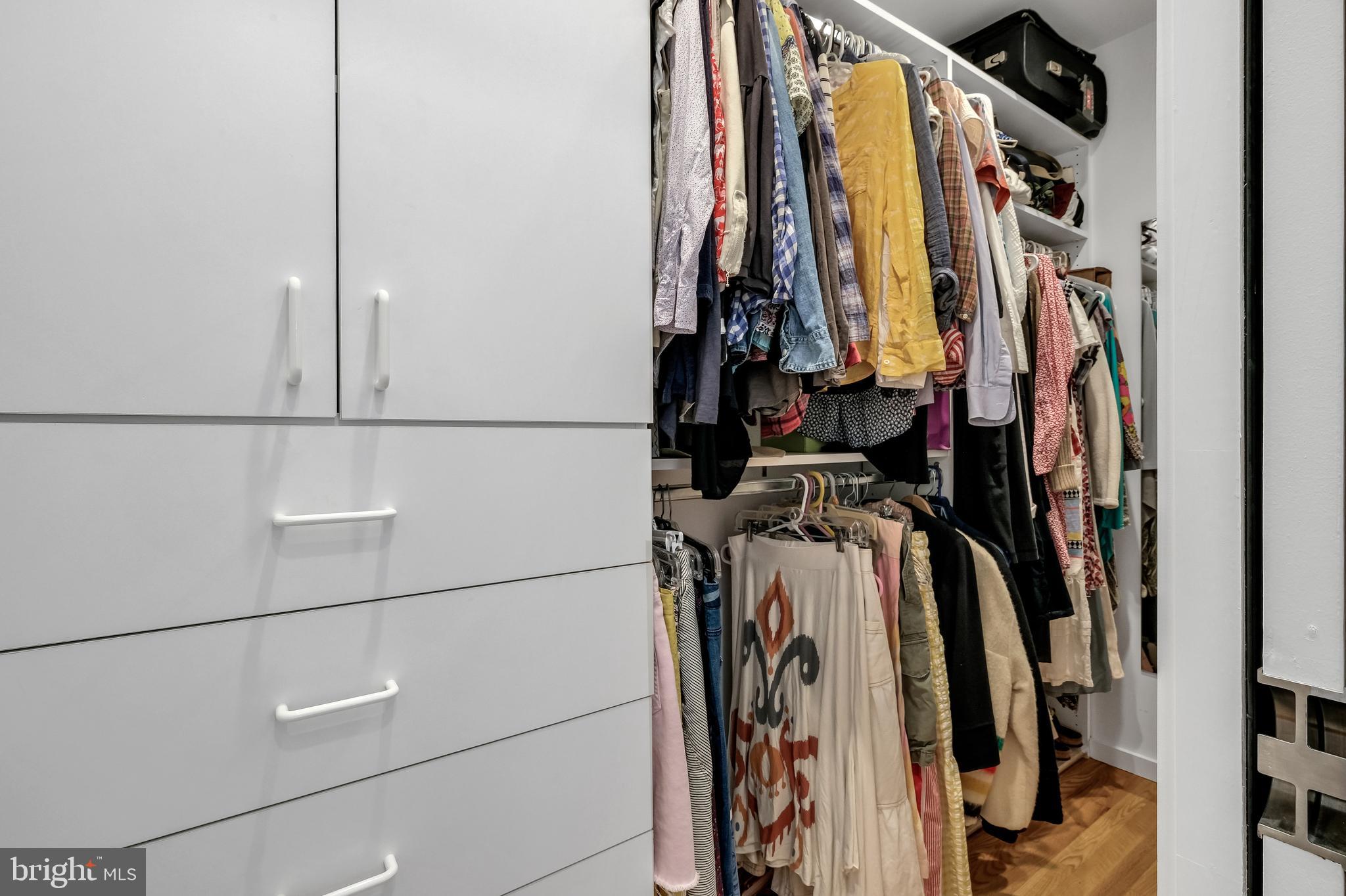 8303 Still Spring Court Bethesda, MD 20817 - Photo 31 of 56 a view of walk in closet with clothes and shoes