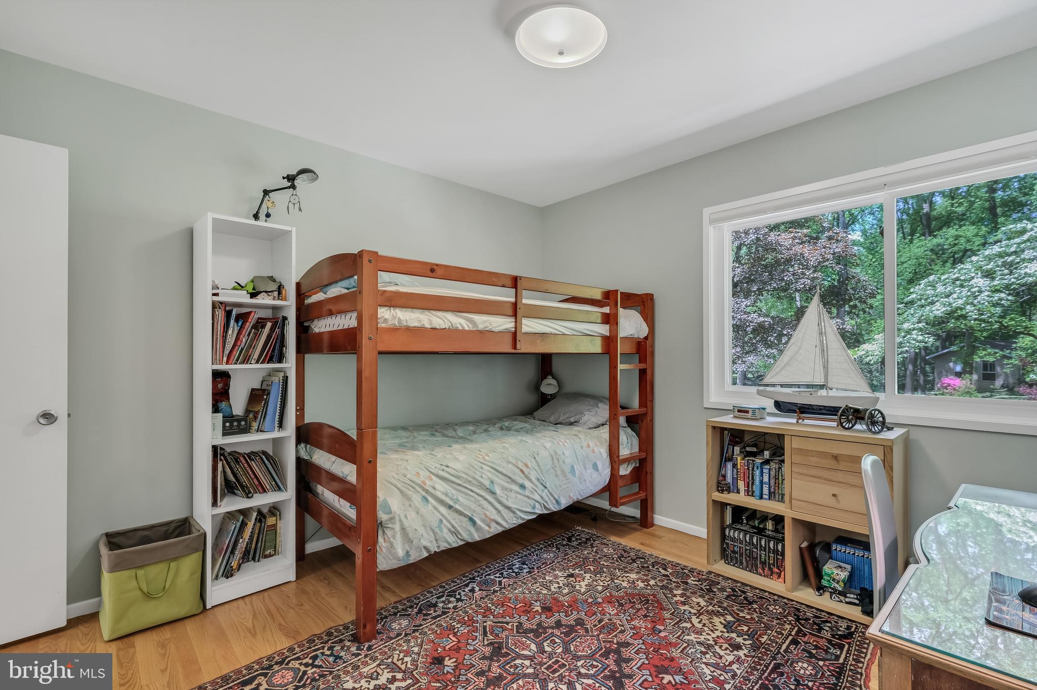 8303 Still Spring Court Bethesda, MD 20817 - Photo 36 of 56 a bedroom with a bed and a window