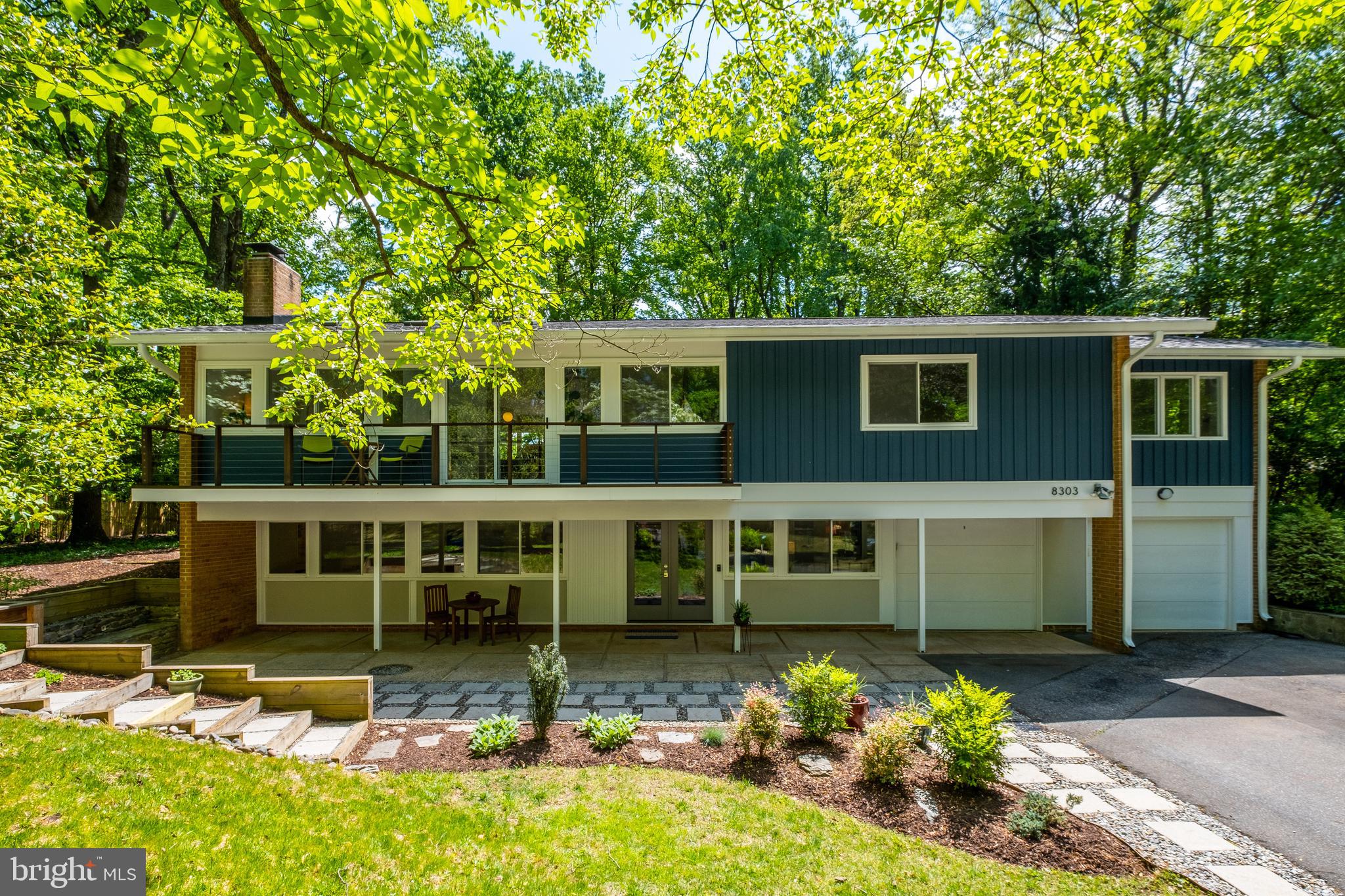 8303 Still Spring Court Bethesda, MD 20817 - Photo 4 of 56 a view of a house with swimming pool next to a yard