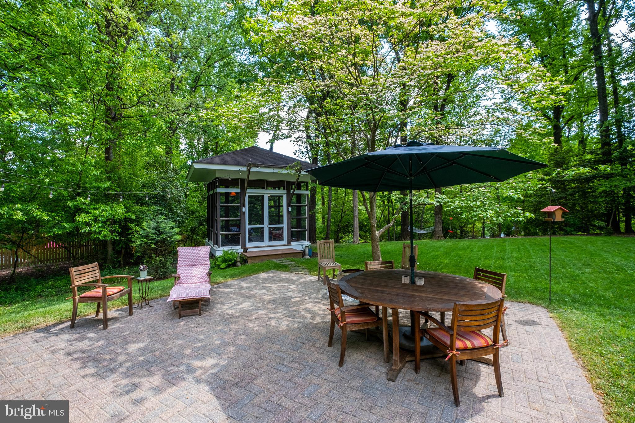 8303 Still Spring Court Bethesda, MD 20817 - Photo 50 of 56 a table and chairs in the garden