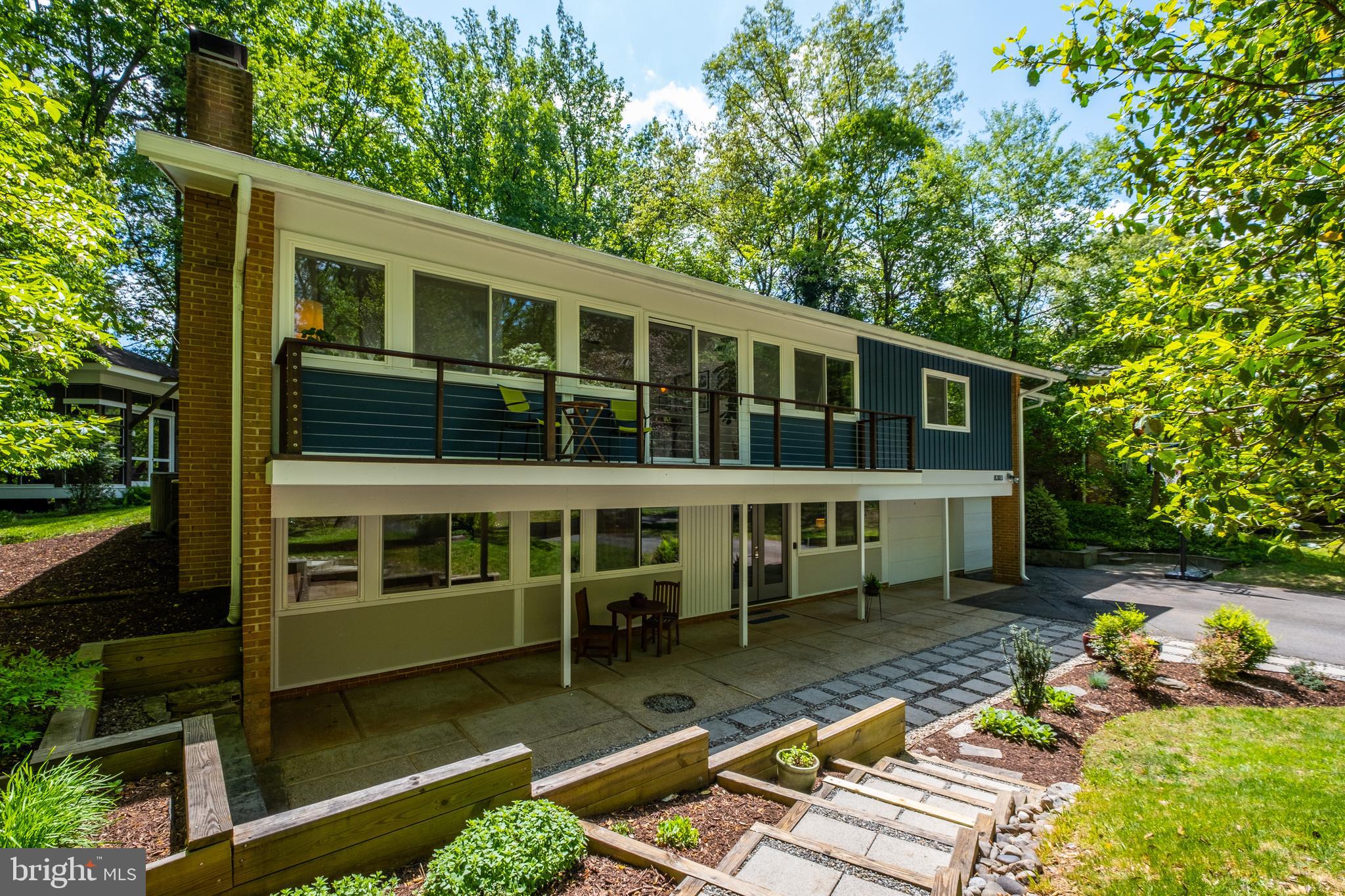 8303 Still Spring Court Bethesda, MD 20817 - Photo 5 of 56 a view of a house with pool and sitting area