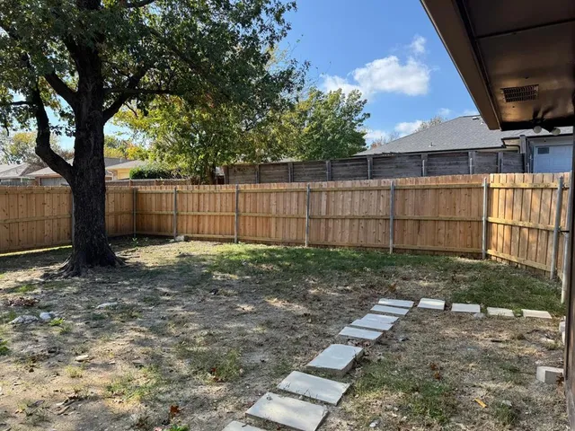 a view of backyard with green space