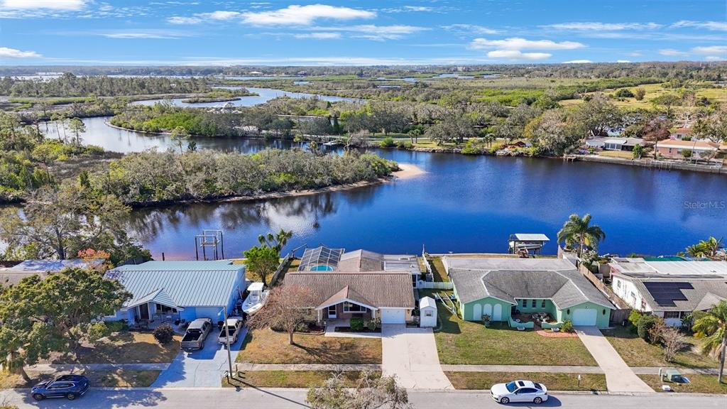 an aerial view of a house with a lake view
