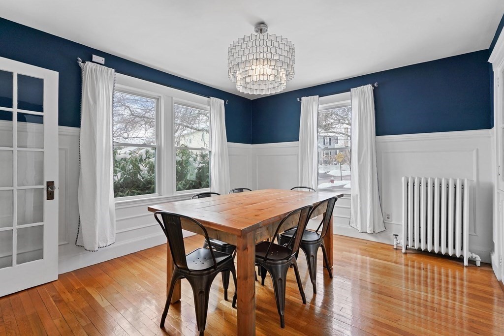 1 Brae Burn Road Milton, MA 02186 - Photo 7 of 16 a dining room with furniture a chandelier and wooden floor