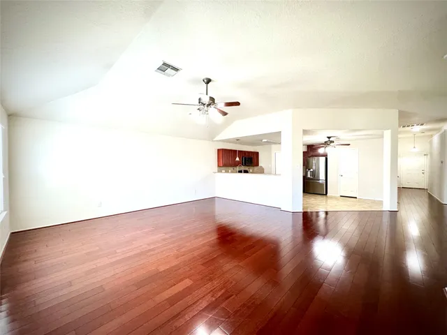 a view of a livingroom with wooden floor