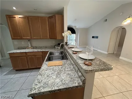 a kitchen with a sink and cabinets
