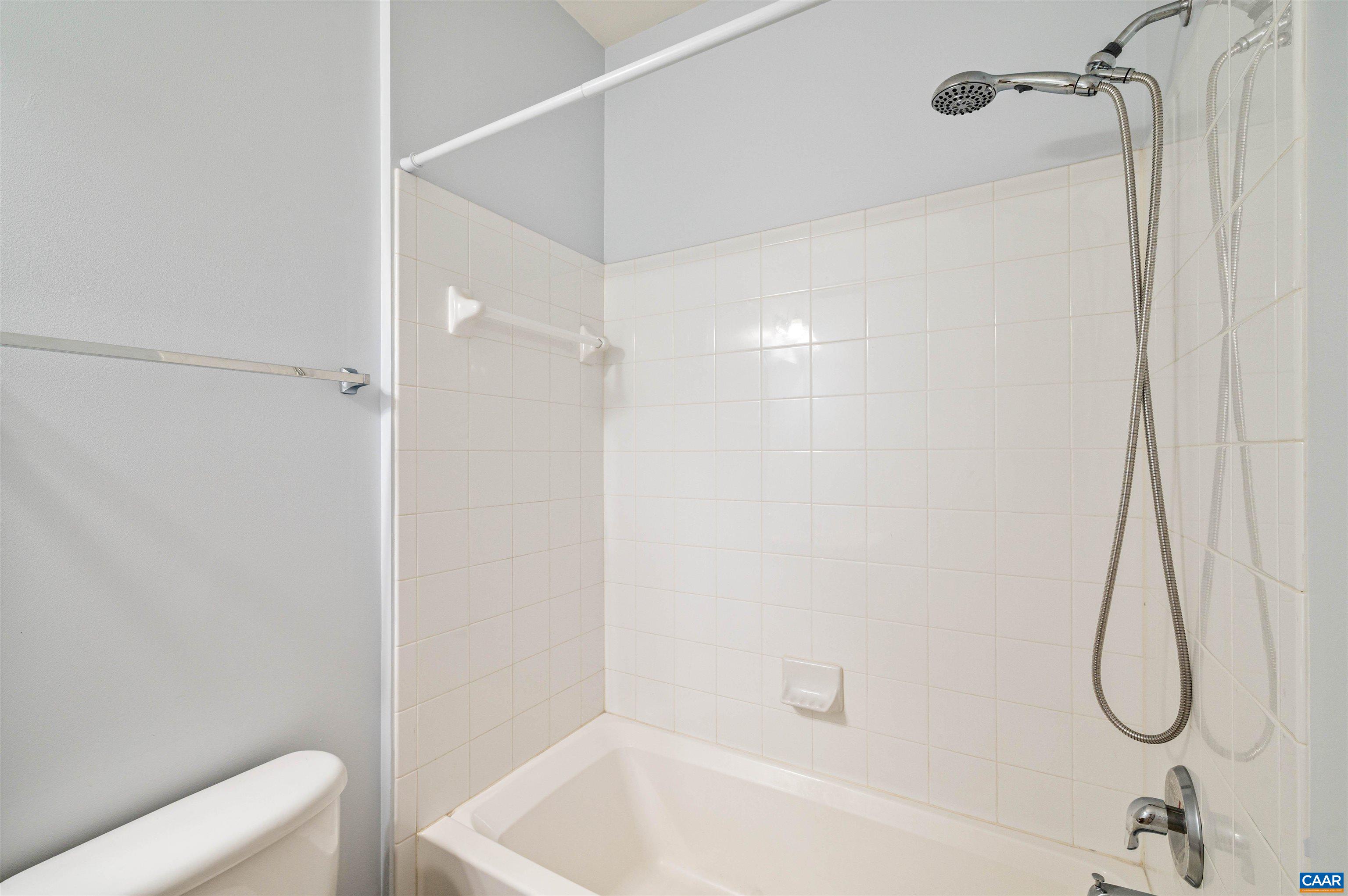 709 Rainier Road Charlottesville, VA 22903 - Photo 13 of 53 a bathroom with a bath tub with a shower