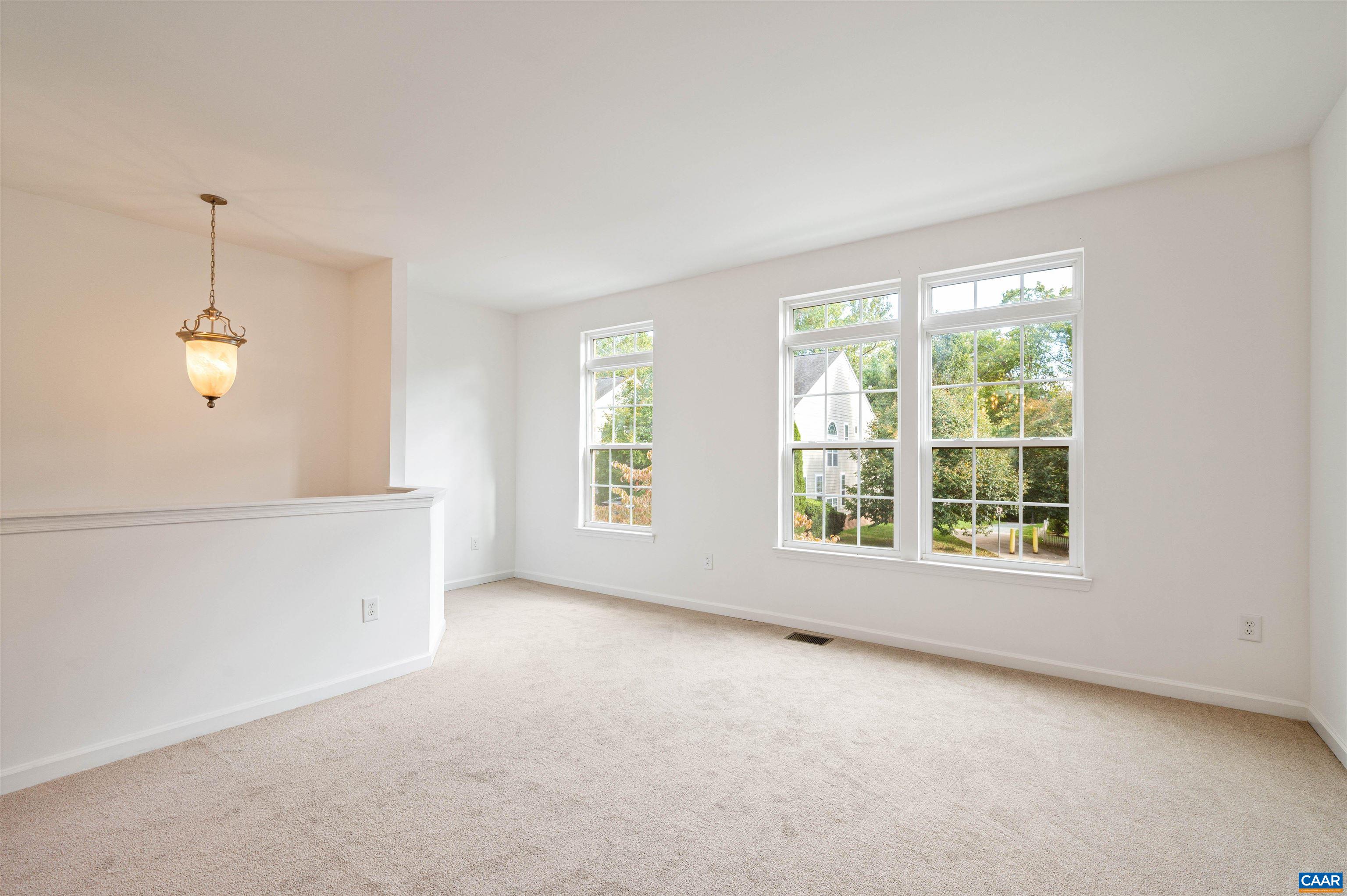 709 Rainier Road Charlottesville, VA 22903 - Photo 17 of 53 an empty room with windows
