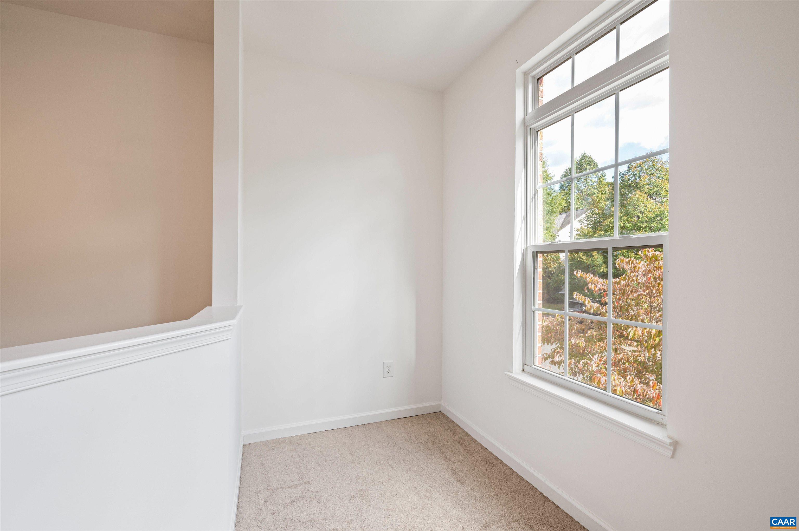 709 Rainier Road Charlottesville, VA 22903 - Photo 19 of 53 an empty room with a window