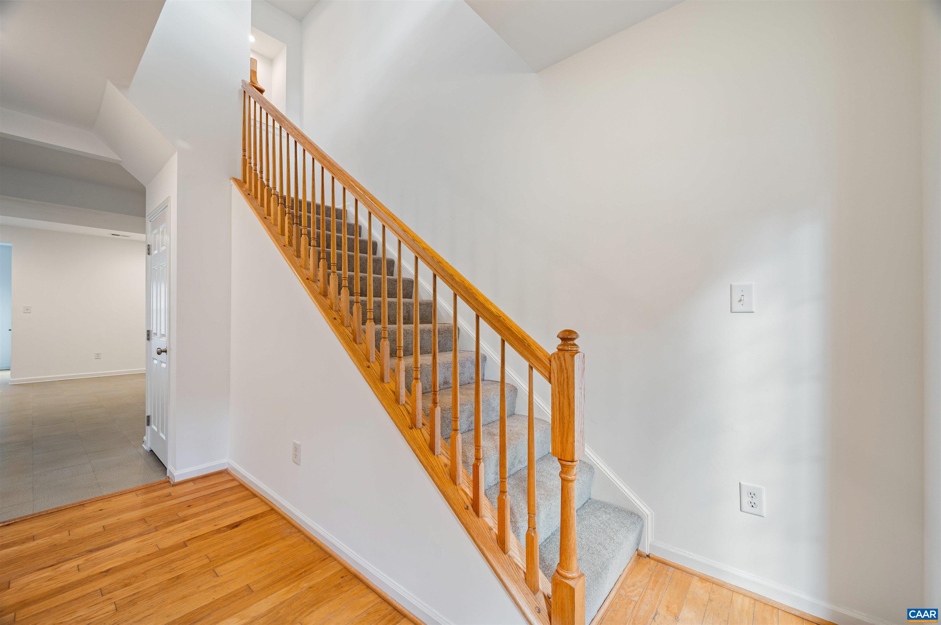 709 Rainier Road Charlottesville, VA 22903 - Photo 4 of 53 a view of a hallway with wooden floor and staircase