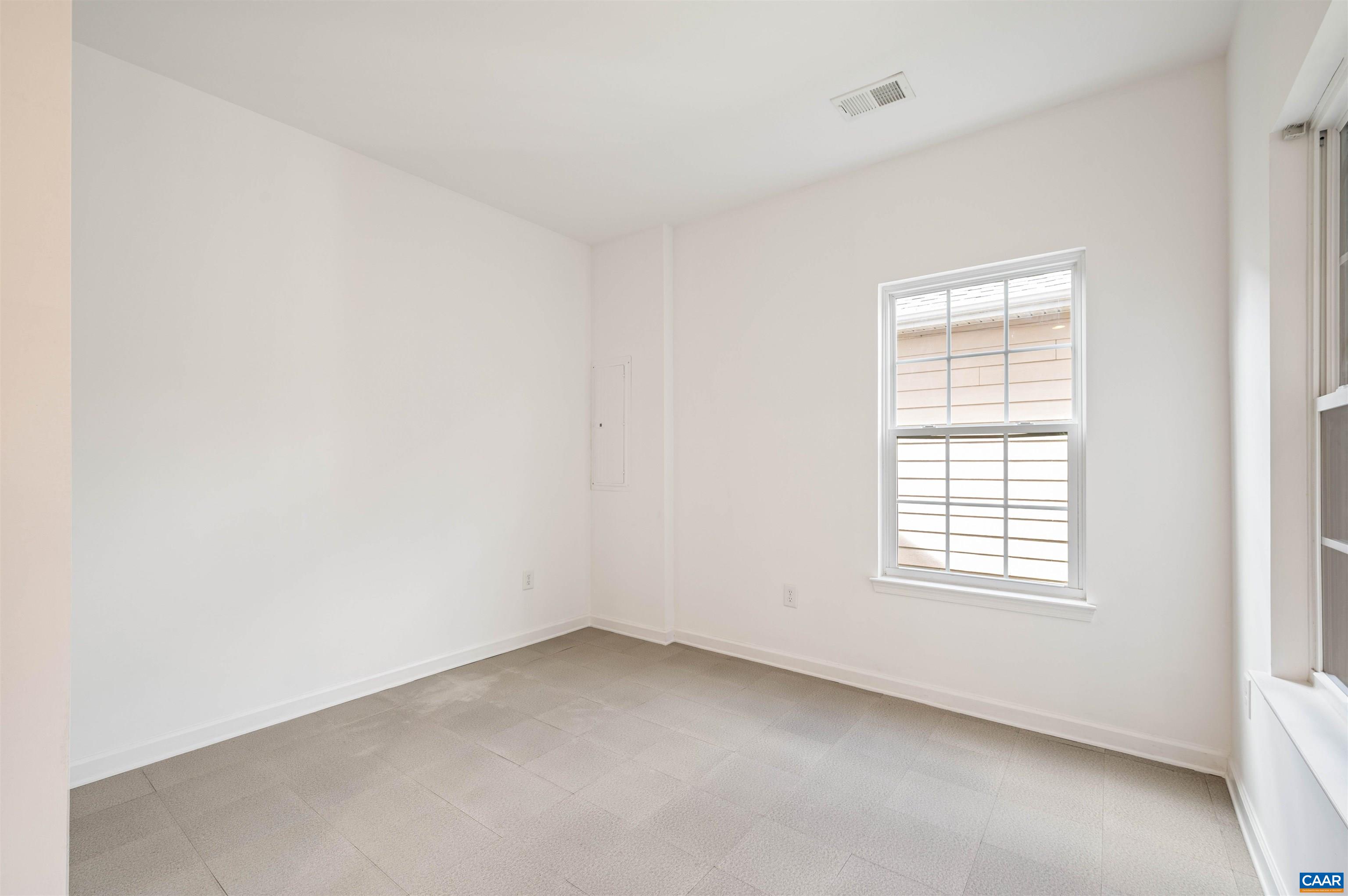 709 Rainier Road Charlottesville, VA 22903 - Photo 8 of 53 an empty room with a window