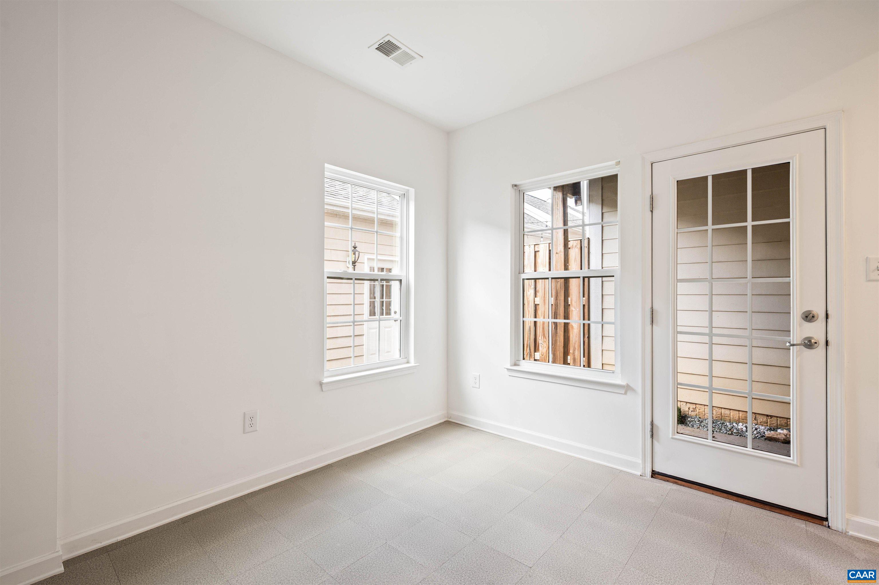 709 Rainier Road Charlottesville, VA 22903 - Photo 9 of 53 an empty room with windows
