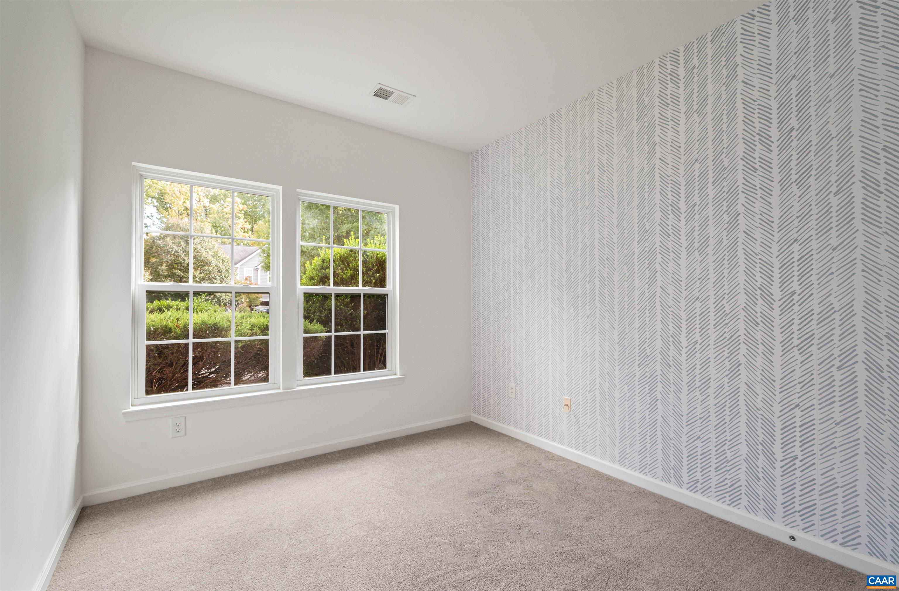 709 Rainier Road Charlottesville, VA 22903 - Photo 10 of 53 a view of an empty room with a window