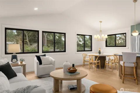 a kitchen with a table chairs stove and cabinets