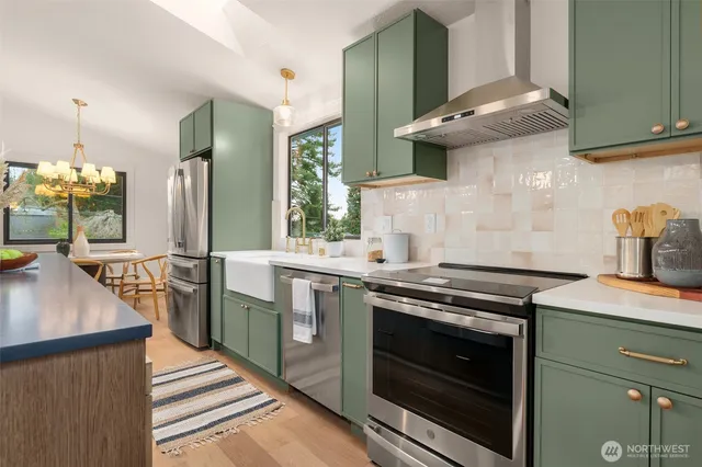 a kitchen with a sink stove and cabinets