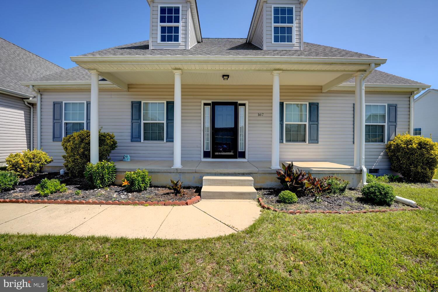 167 Spring Dale Lane Felton, DE 19943 - Photo 2 of 54 a front view of a house with a yard