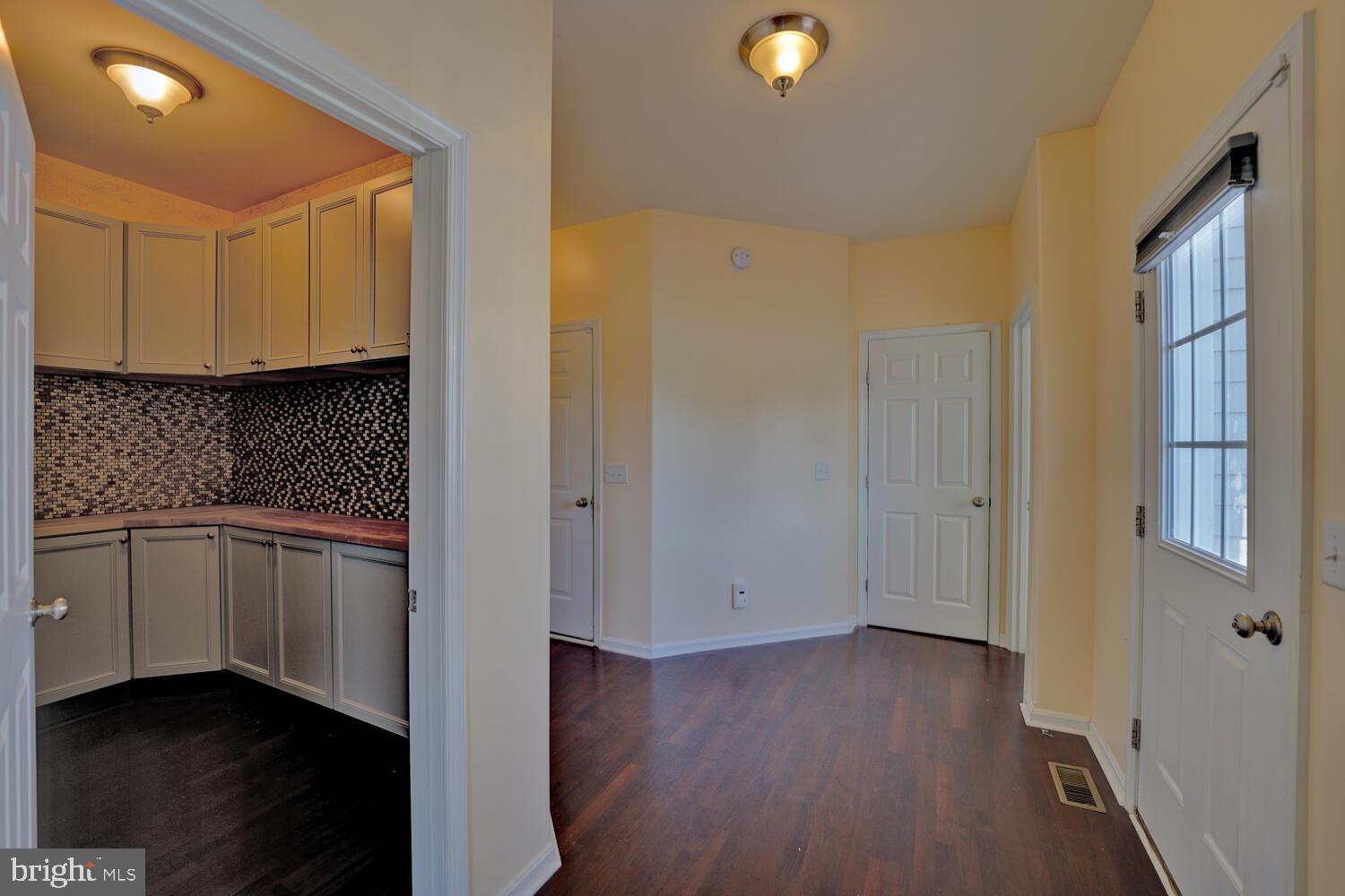 167 Spring Dale Lane Felton, DE 19943 - Photo 25 of 54 a view of a kitchen with a sink and dishwasher a oven with wooden floor
