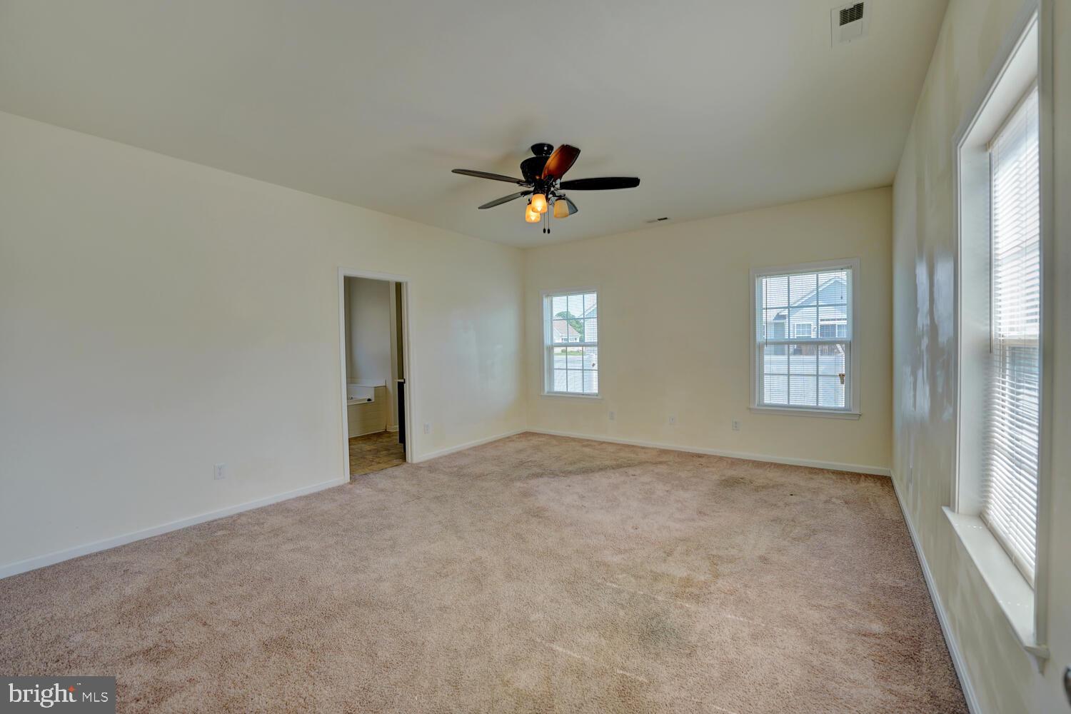 167 Spring Dale Lane Felton, DE 19943 - Photo 28 of 54 a view of a room with a ceiling fan and windows
