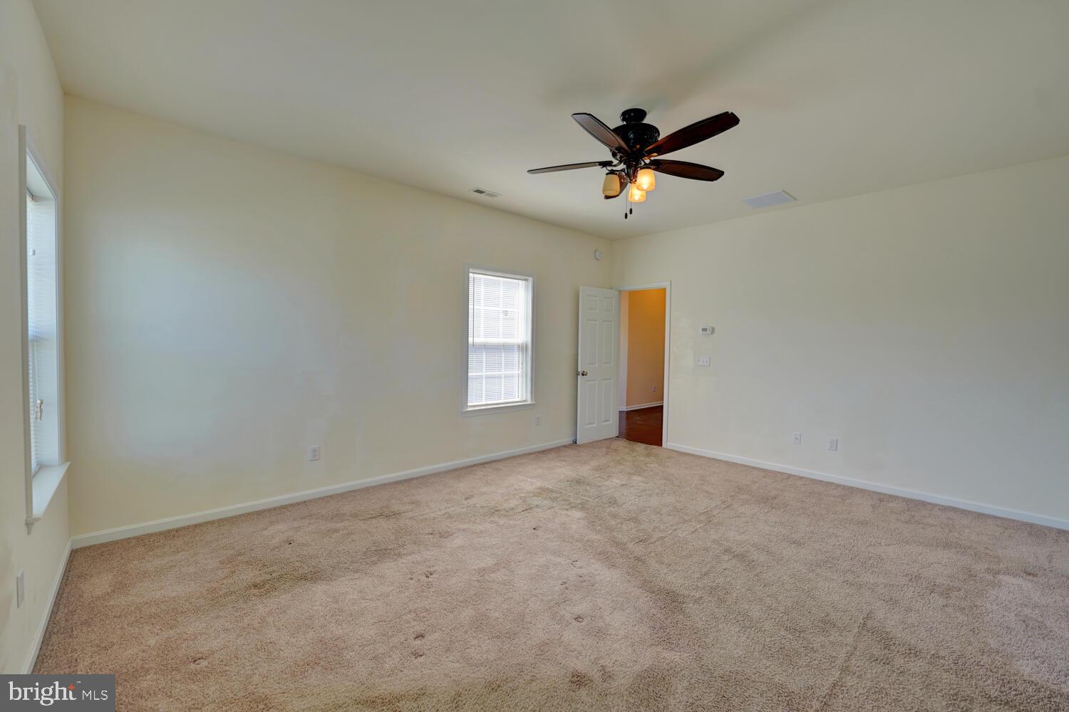 167 Spring Dale Lane Felton, DE 19943 - Photo 30 of 54 an empty room with windows and fan