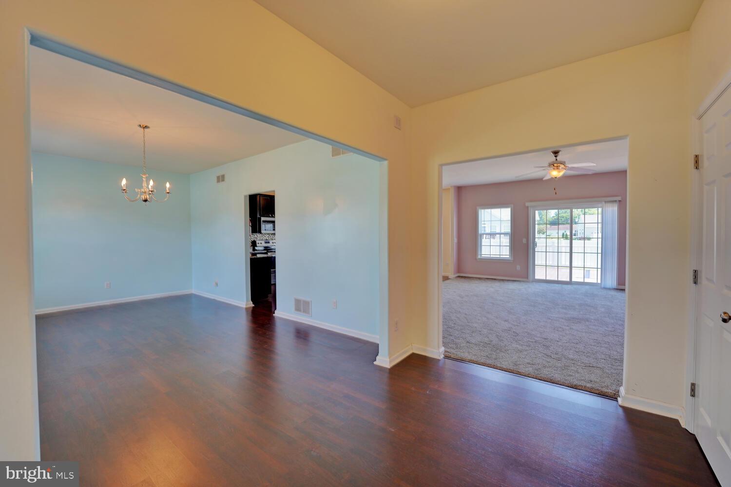 167 Spring Dale Lane Felton, DE 19943 - Photo 9 of 54 a view of an empty room with wooden floor and a window