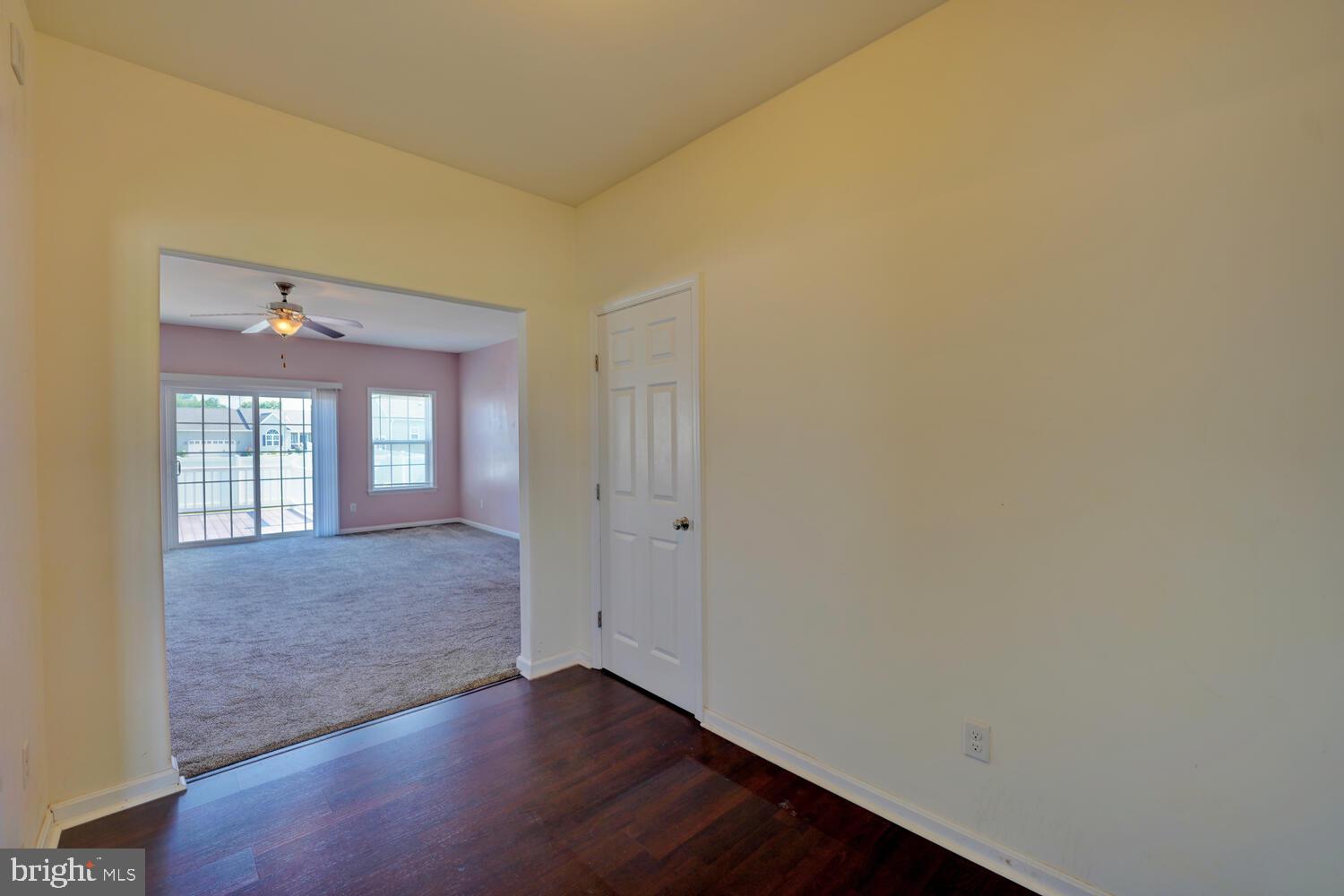 167 Spring Dale Lane Felton, DE 19943 - Photo 10 of 54 an empty room with wooden floor and windows