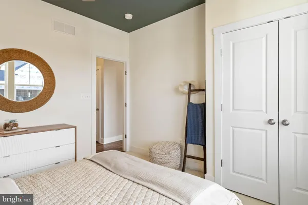 a bedroom with a bed and a table in it