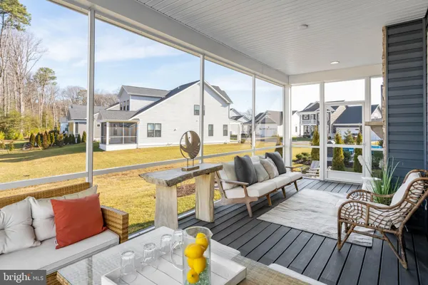 a swimming pool with outdoor seating and yard