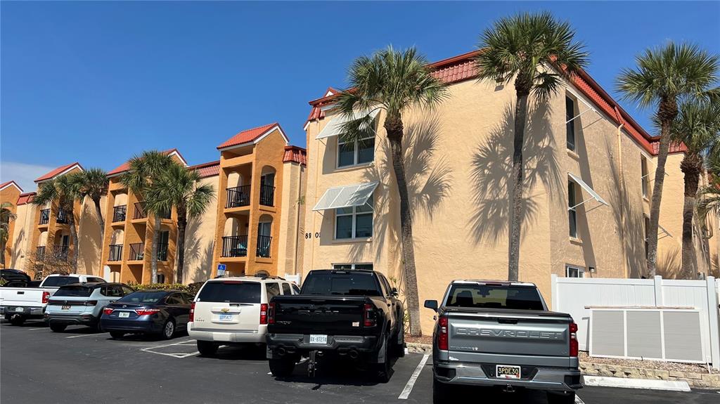 8901 Blind Pass Road, Unit 224 St. Pete Beach, FL 33706 - Photo 2 of 46 a car parked in front of a building