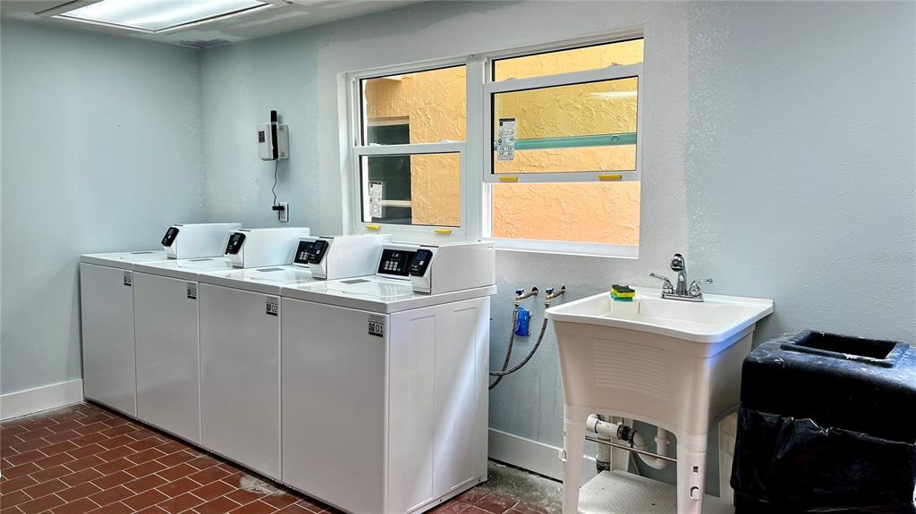 8901 Blind Pass Road, Unit 224 St. Pete Beach, FL 33706 - Photo 32 of 46 a room with a window and washer dryer