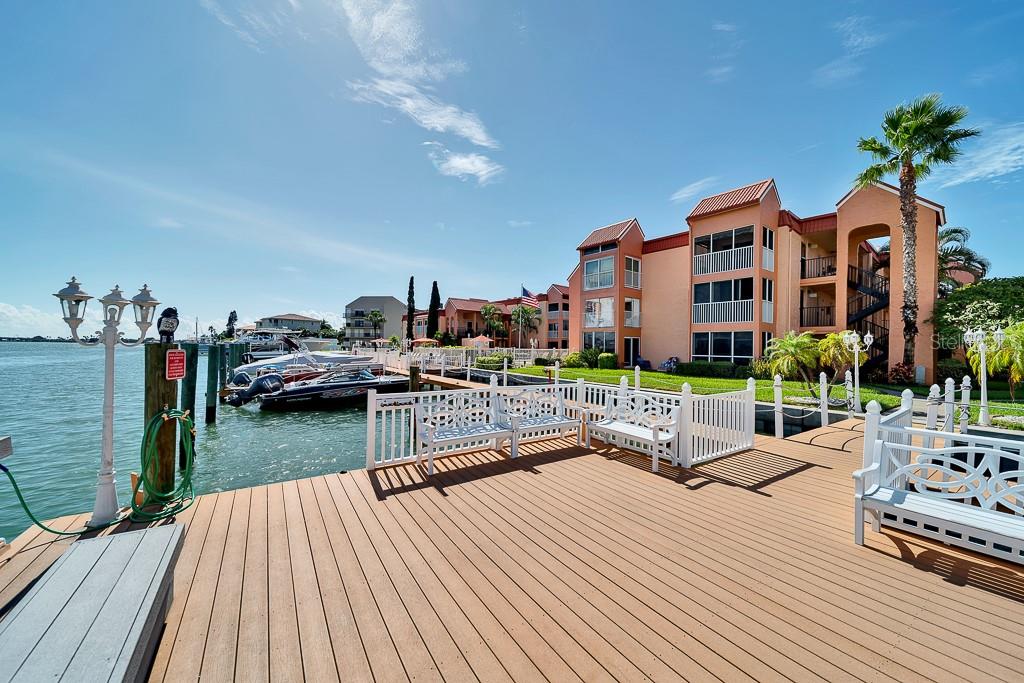 8901 Blind Pass Road, Unit 224 St. Pete Beach, FL 33706 - Photo 34 of 46 a view of a house with yard and sitting area