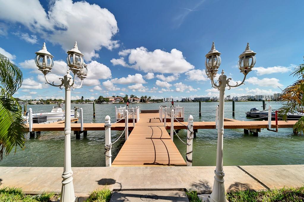 8901 Blind Pass Road, Unit 224 St. Pete Beach, FL 33706 - Photo 37 of 46 a view of a lake with sitting area