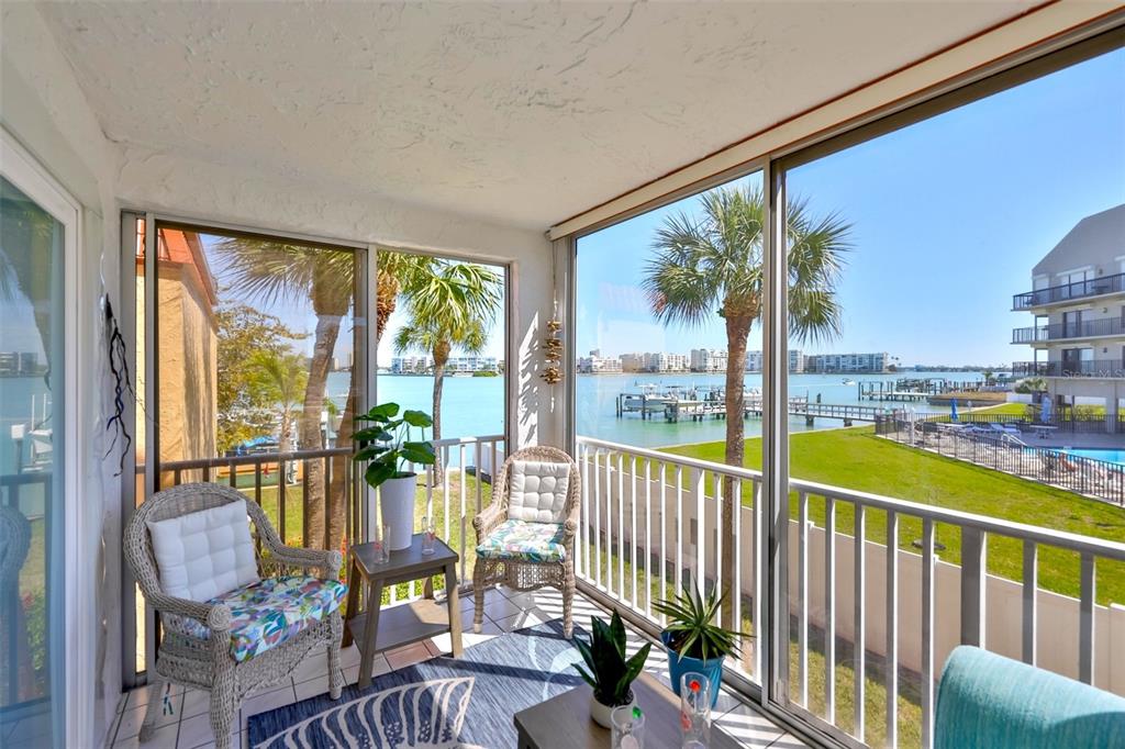 8901 Blind Pass Road, Unit 224 St. Pete Beach, FL 33706 - Photo 4 of 46 a view of a city from a balcony